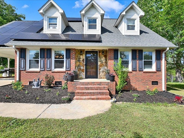 415 Van Martin Rd, Anderson, SC 29621 - new england style home featuring roof with shingles, solar panels, a front lawn, and brick siding