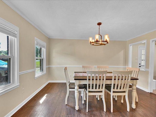 415 Van Martin Rd, Anderson, SC 29621 - dining space with a textured ceiling, a chandelier, baseboards, wood finished floors, and ornamental molding