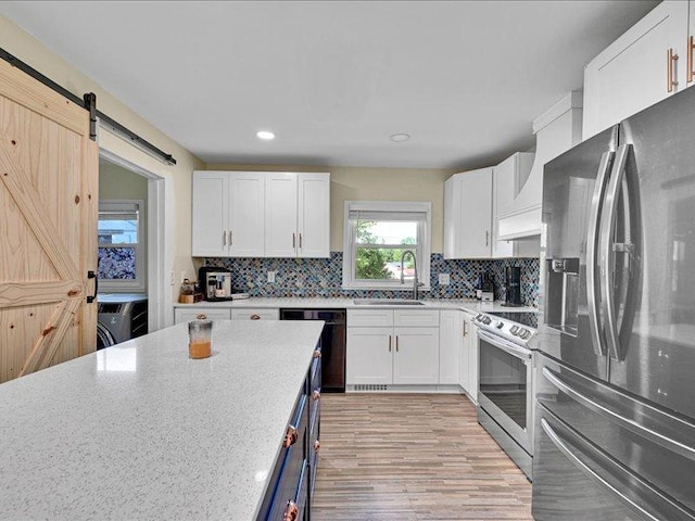 415 Van Martin Rd, Anderson, SC 29621 - kitchen with premium range hood, white cabinetry, a sink, backsplash, and stainless steel appliances