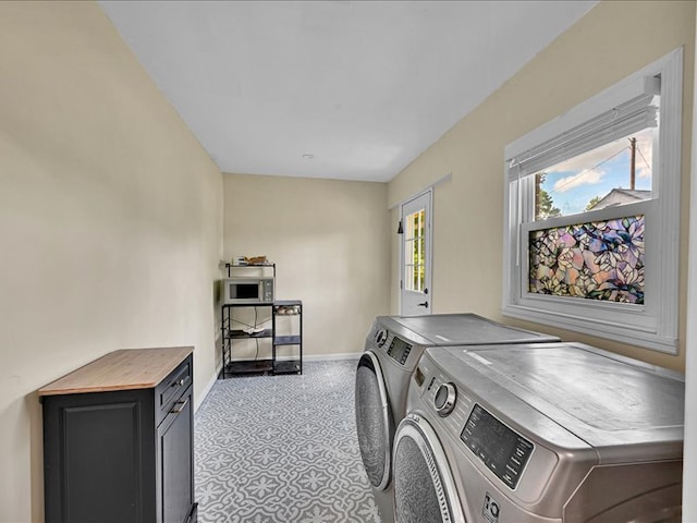 415 Van Martin Rd, Anderson, SC 29621 - laundry room featuring baseboards, cabinet space, and washer and dryer