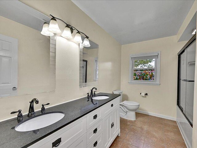 415 Van Martin Rd, Anderson, SC 29621 - full bath featuring baseboards, toilet, a shower with door, and a sink
