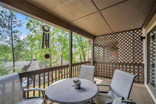 wooden terrace with outdoor dining space
