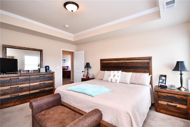 carpeted bedroom featuring visible vents and ornamental molding