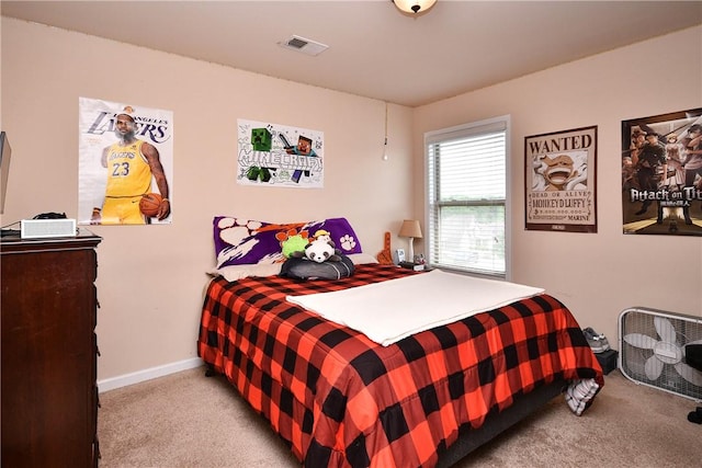 bedroom with carpet floors, baseboards, and visible vents