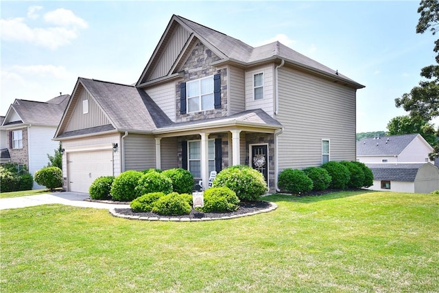 view of front of property featuring an attached garage, board and batten siding, a front yard, and concrete driveway