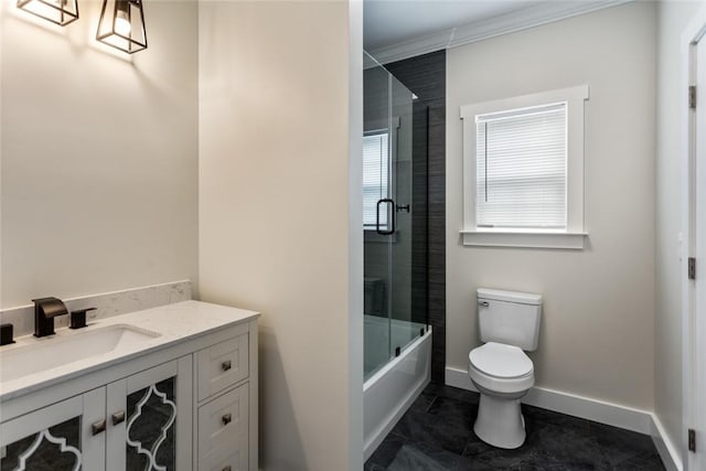 bathroom featuring crown molding, tile patterned flooring, vanity, baseboards, and toilet
