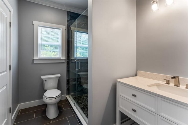 bathroom with tile patterned flooring, a shower stall, vanity, baseboards, and toilet