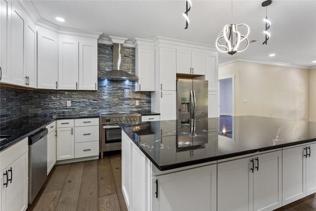 kitchen with wall chimney range hood, stainless steel appliances, dark wood finished floors, and white cabinetry