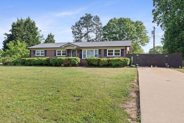 302 Jasmine Dr, Anderson, SC 29625 - single story home with fence, concrete driveway, a front lawn, and brick siding