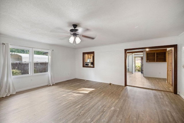 302 Jasmine Dr, Anderson, SC 29625 - empty room with plenty of natural light, crown molding, ceiling fan, and wood finished floors