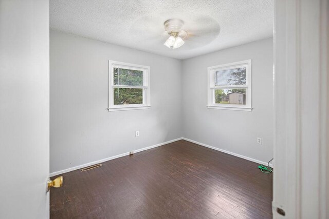 302 Jasmine Dr, Anderson, SC 29625 - empty room with baseboards, a ceiling fan, a healthy amount of sunlight, and dark wood-style floors