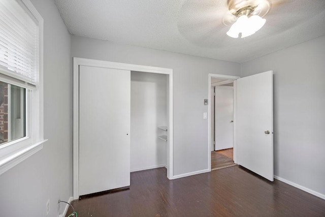 302 Jasmine Dr, Anderson, SC 29625 - unfurnished bedroom with a ceiling fan, a textured ceiling, wood finished floors, baseboards, and a closet
