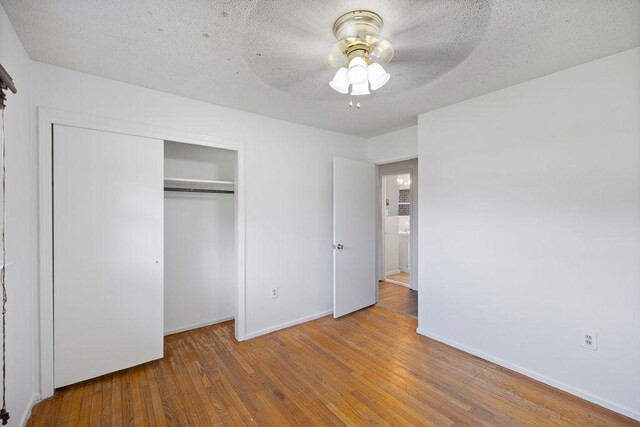 302 Jasmine Dr, Anderson, SC 29625 - unfurnished bedroom featuring a closet, baseboards, and wood finished floors