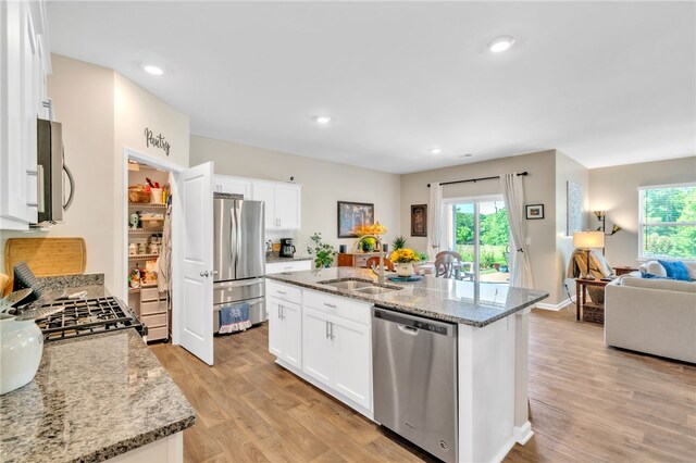 201 Sweetgrass Ln, Piedmont, SC 29673 - kitchen with a sink, appliances with stainless steel finishes, white cabinets, and a wealth of natural light