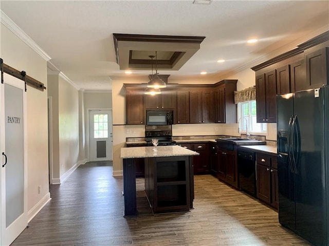 204 Rock Creek Rd, Anderson, SC 29625 - kitchen featuring black appliances, dark brown cabinetry, a center island, ornamental molding, and a sink
