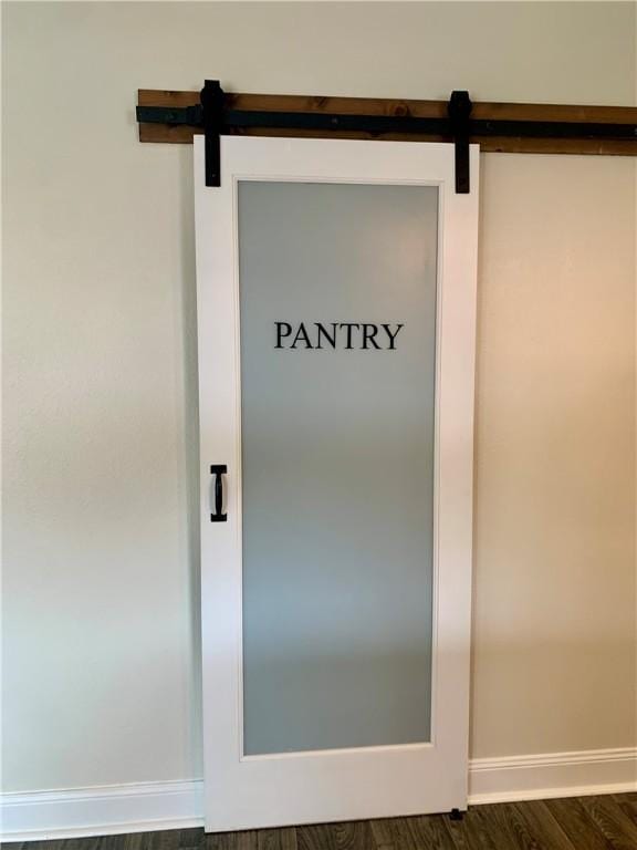 204 Rock Creek Rd, Anderson, SC 29625 - detailed view of a barn door, baseboards, and wood finished floors