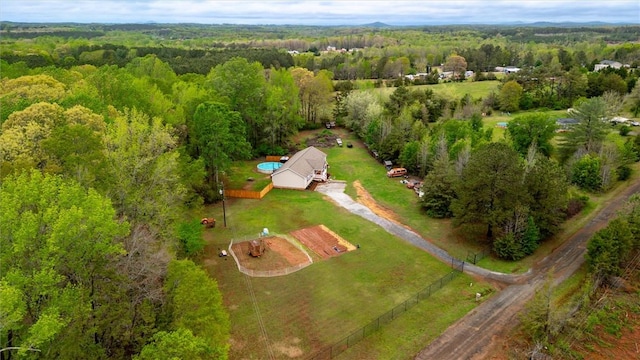 bird's eye view featuring a wooded view
