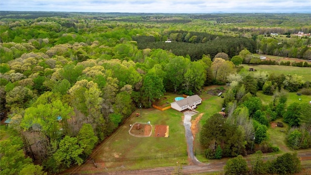 birds eye view of property with a wooded view