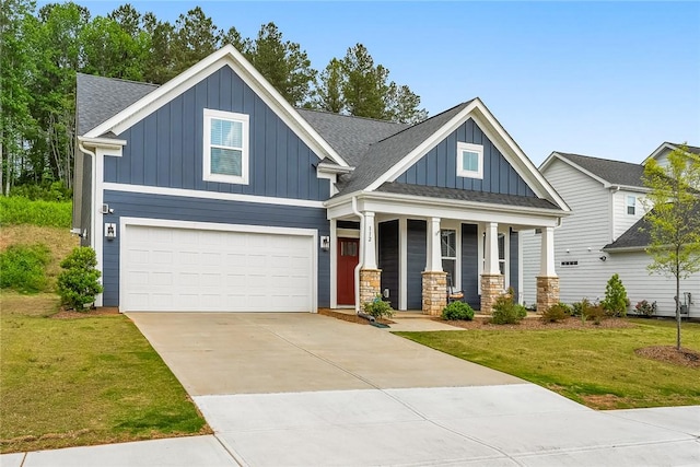 craftsman-style home with board and batten siding, a garage, a porch, and a front lawn