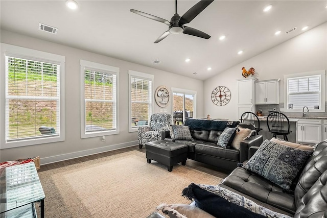 living area with recessed lighting, a ceiling fan, light wood finished floors, and visible vents