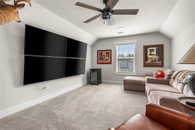 carpeted living room with visible vents, a ceiling fan, baseboards, and vaulted ceiling