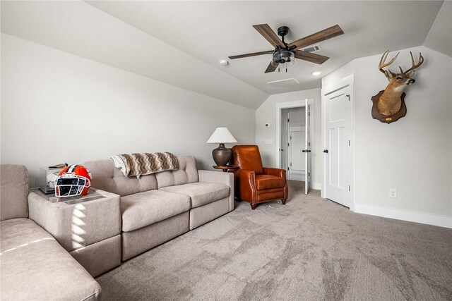 living area with a ceiling fan, visible vents, baseboards, lofted ceiling, and light carpet