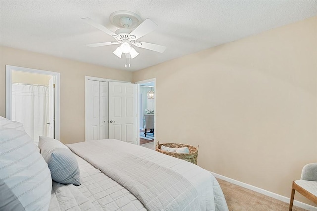 bedroom featuring light colored carpet, baseboards, and ceiling fan
