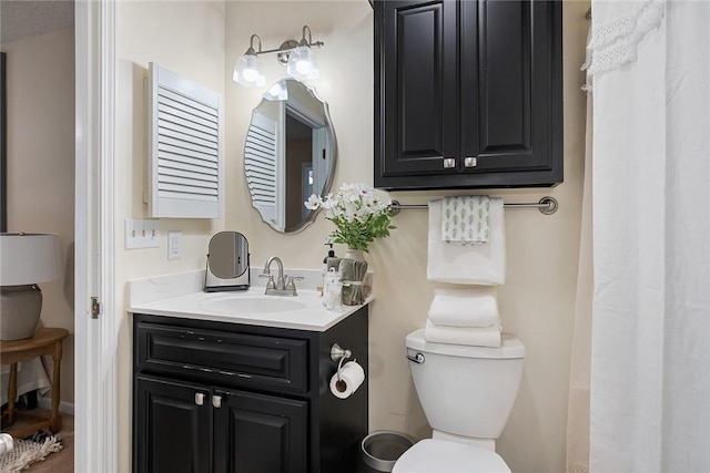 full bathroom featuring vanity and toilet