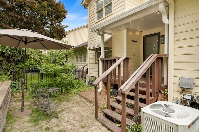entrance to property with central AC and fence