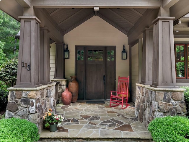 entrance to property featuring stone siding