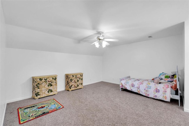 bedroom featuring carpet flooring, baseboards, and lofted ceiling