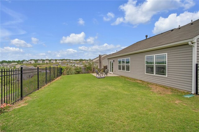 view of yard with a patio and a fenced backyard