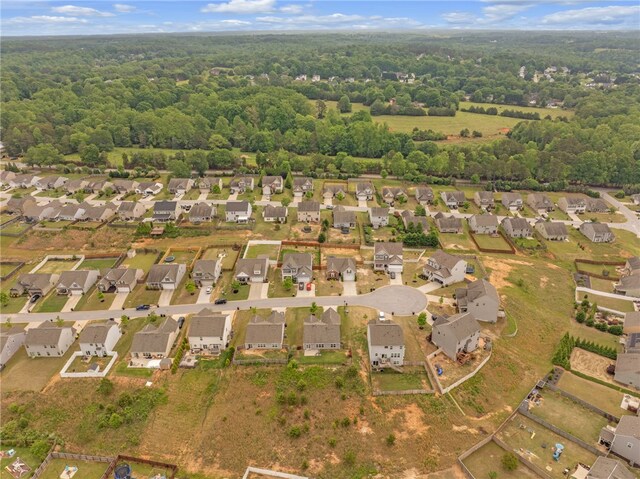 aerial view featuring a residential view and a forest view