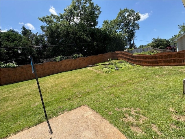 view of yard with a fenced backyard