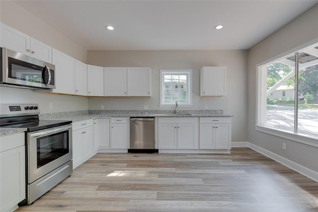 9 Dixie Ave, Liberty, SC 29657 - kitchen featuring recessed lighting, appliances with stainless steel finishes, a wealth of natural light, and a sink