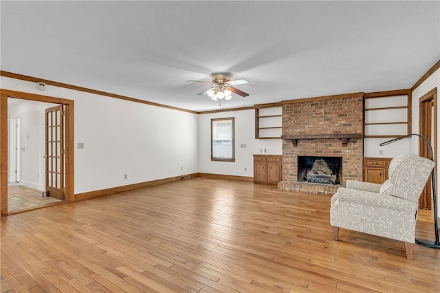 2018 Concord Rd, Anderson, SC 29621 - unfurnished living room with crown molding, light wood finished floors, ceiling fan, and baseboards
