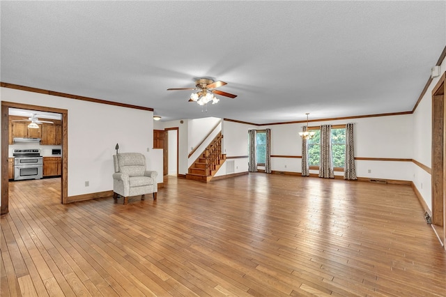 2018 Concord Rd, Anderson, SC 29621 - unfurnished living room featuring stairway, light wood finished floors, and ceiling fan with notable chandelier