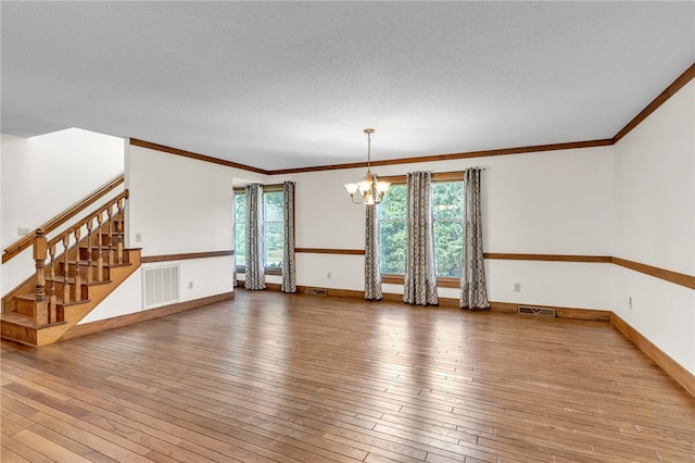2018 Concord Rd, Anderson, SC 29621 - spare room with wood-type flooring, stairs, a chandelier, and visible vents