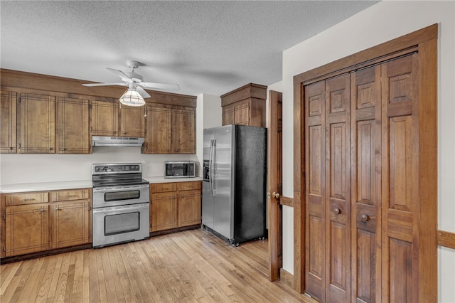 2018 Concord Rd, Anderson, SC 29621 - kitchen with ceiling fan, light countertops, stainless steel appliances, light wood-type flooring, and under cabinet range hood