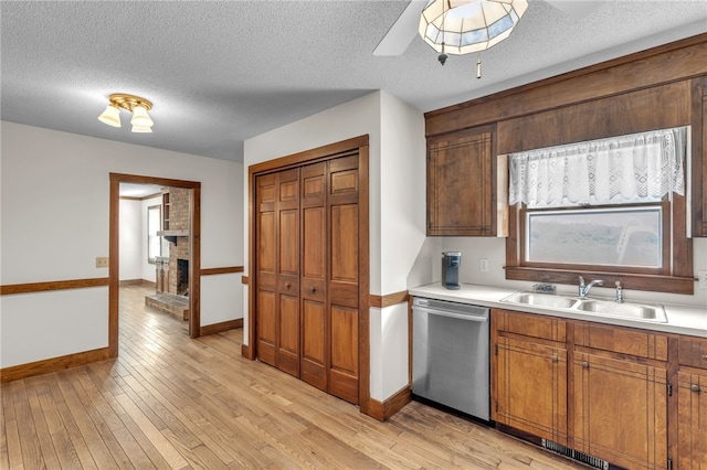 2018 Concord Rd, Anderson, SC 29621 - kitchen with a sink, light countertops, light wood-style flooring, baseboards, and stainless steel dishwasher