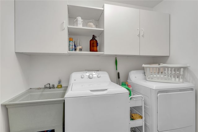 2018 Concord Rd, Anderson, SC 29621 - laundry area featuring cabinet space, a sink, and washer and dryer