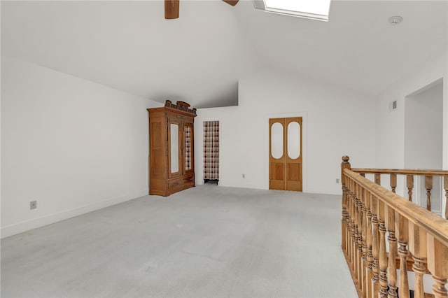 2018 Concord Rd, Anderson, SC 29621 - unfurnished room featuring visible vents, light carpet, baseboards, a ceiling fan, and vaulted ceiling