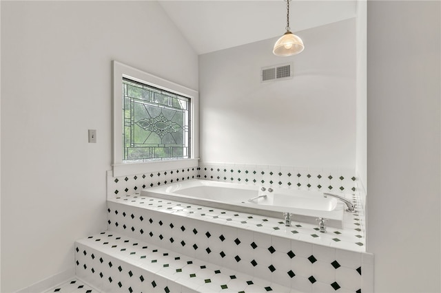 2018 Concord Rd, Anderson, SC 29621 - bathroom with vaulted ceiling, a garden tub, and visible vents