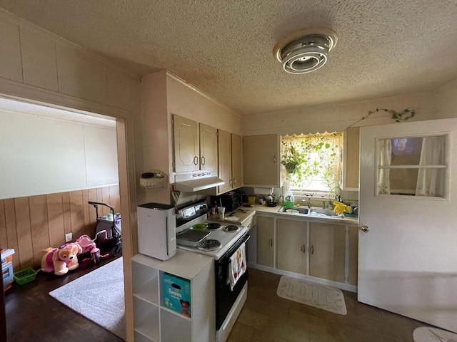 kitchen with a textured ceiling, white range with electric cooktop, light countertops, a sink, and under cabinet range hood