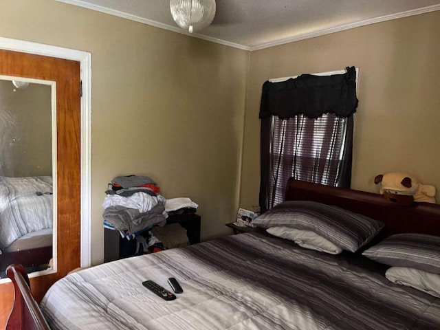 bedroom featuring crown molding