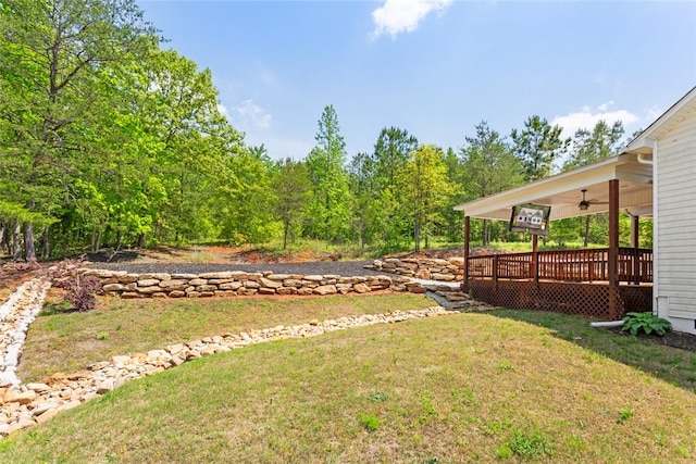 view of yard featuring a ceiling fan