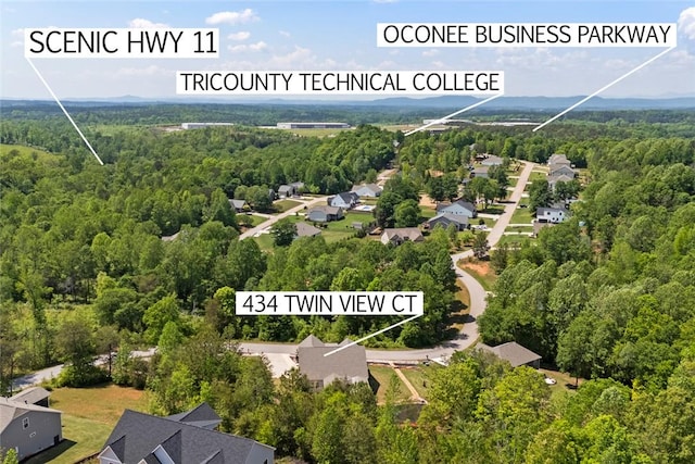 bird's eye view featuring a residential view and a view of trees