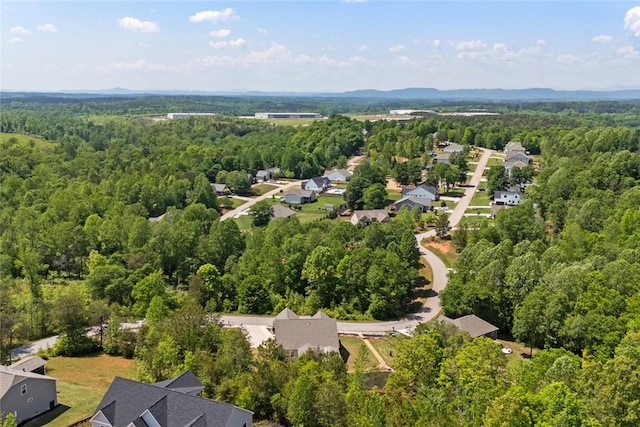 birds eye view of property featuring a view of trees and a residential view