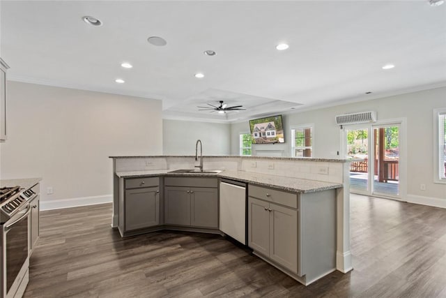 kitchen with a sink, appliances with stainless steel finishes, gray cabinets, and ornamental molding