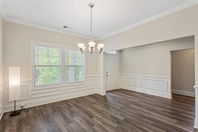 unfurnished dining area with dark wood-style flooring, an inviting chandelier, visible vents, and a wainscoted wall